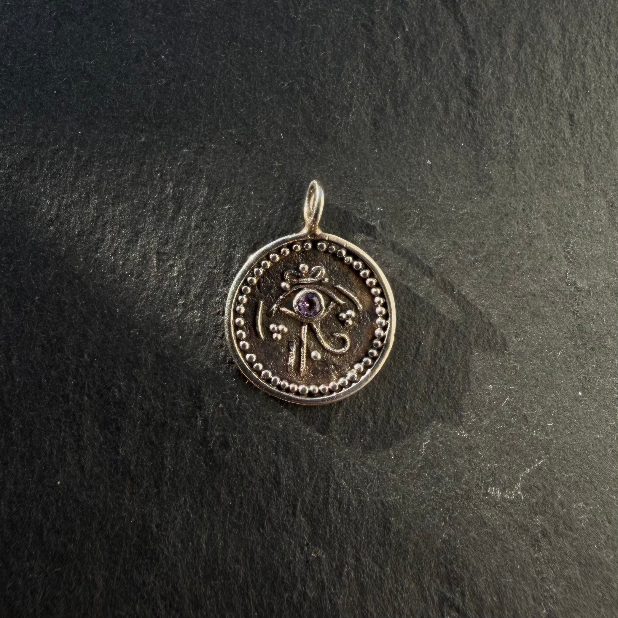 Handcrafted sterling silver Eye of Horus talisman pendant with amethyst gemstone