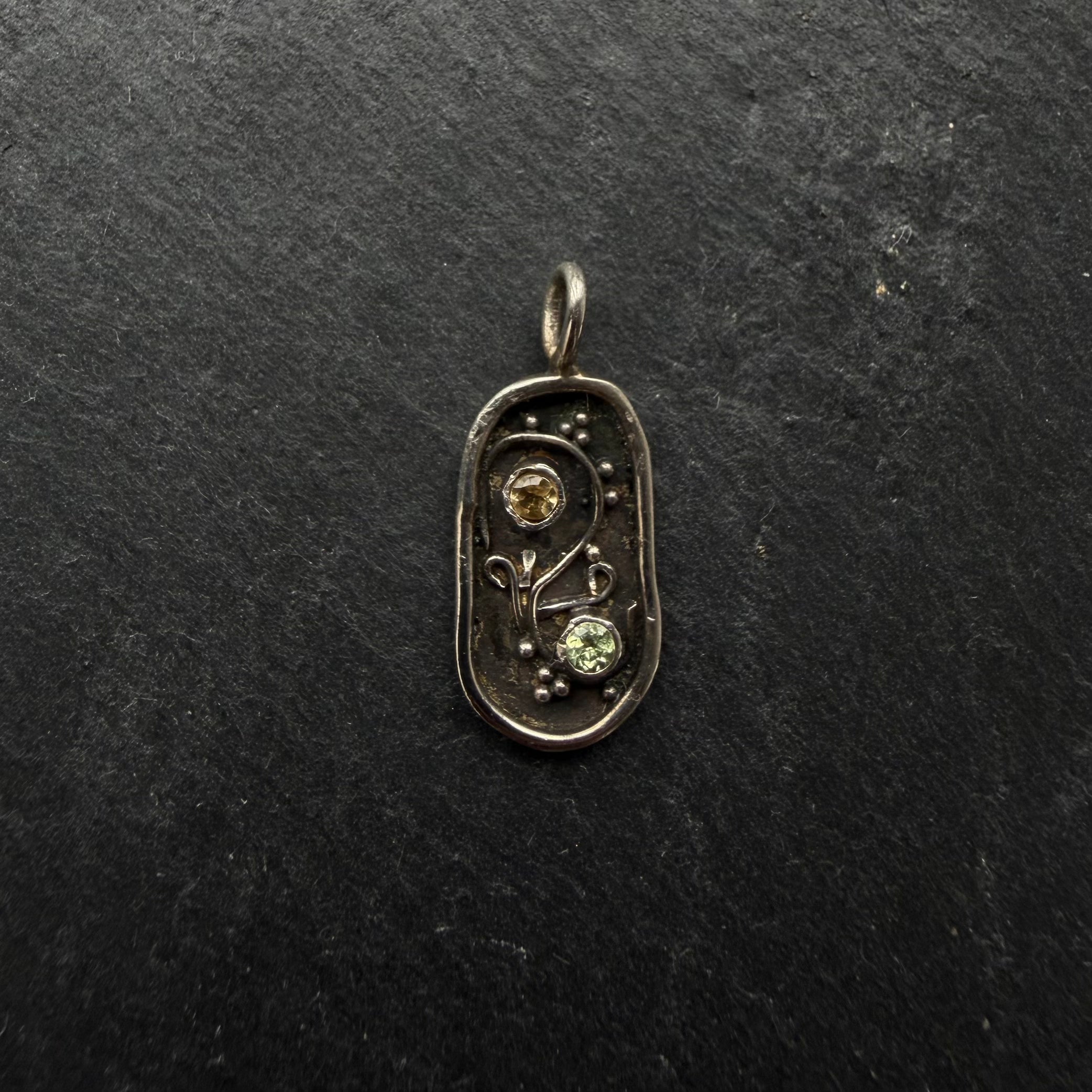 Handcrafted sterling silver Yin Yang talisman pendant with citrine and peridot gemstones