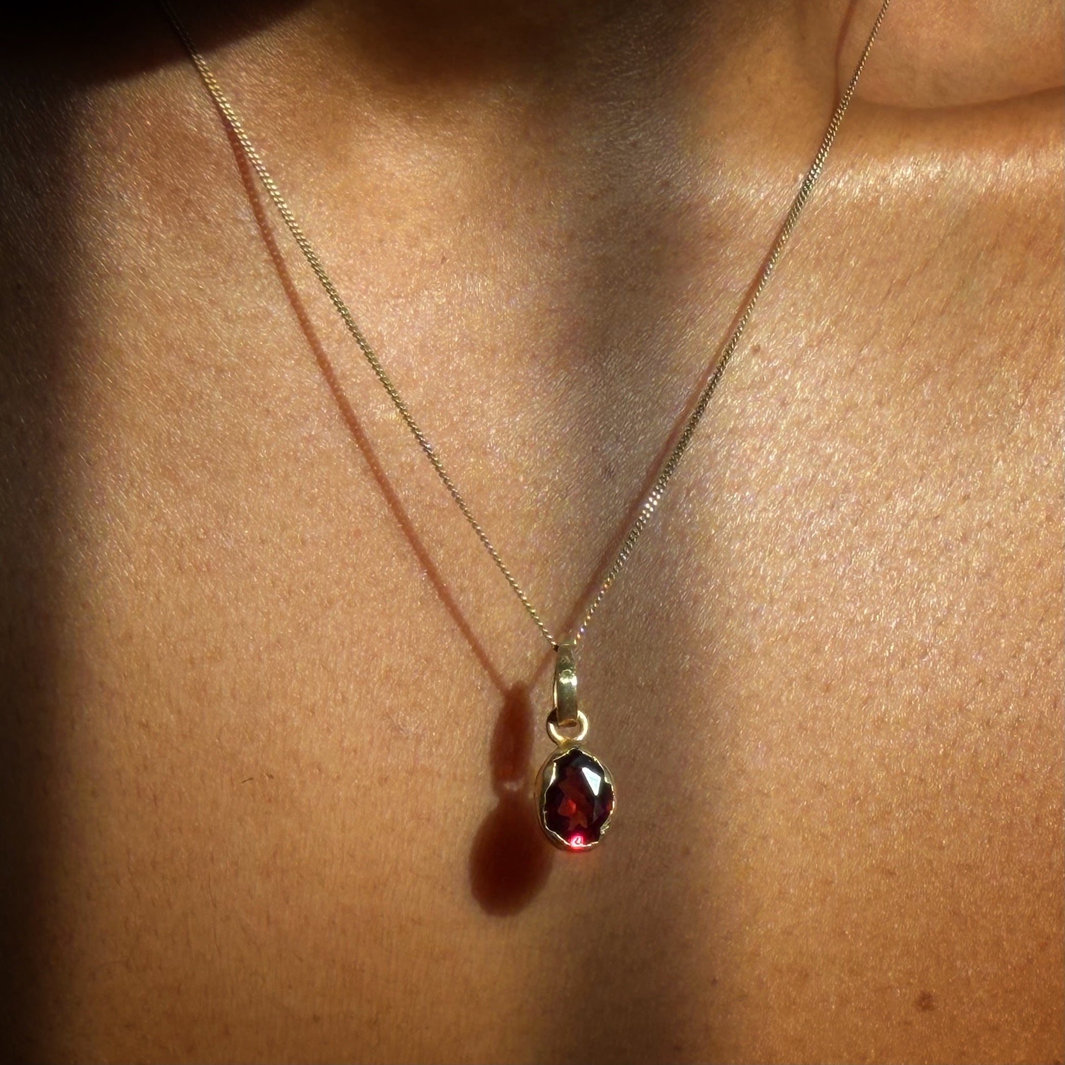 garnet gold necklace on wearing