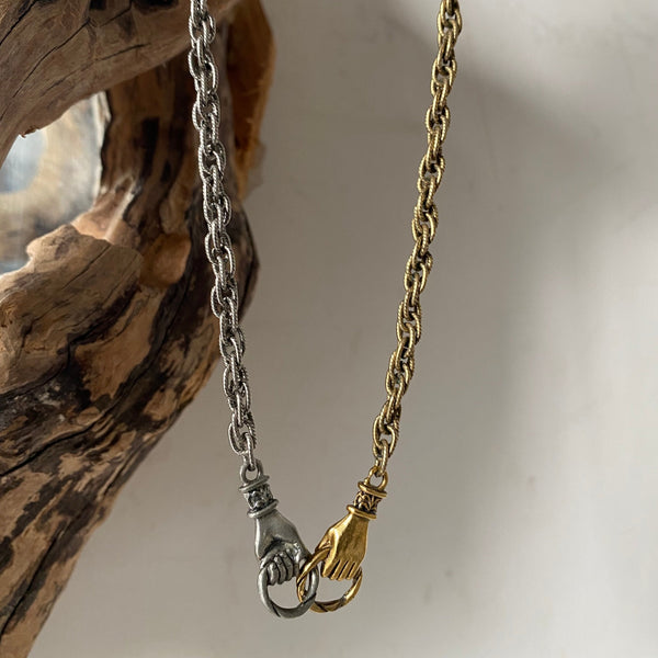 mixed metal hands necklace