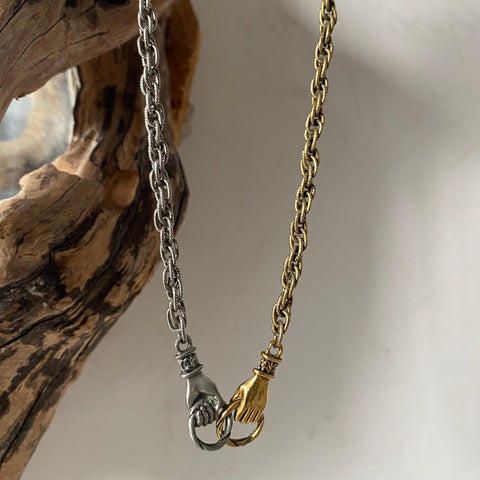 mixed metal hands necklace