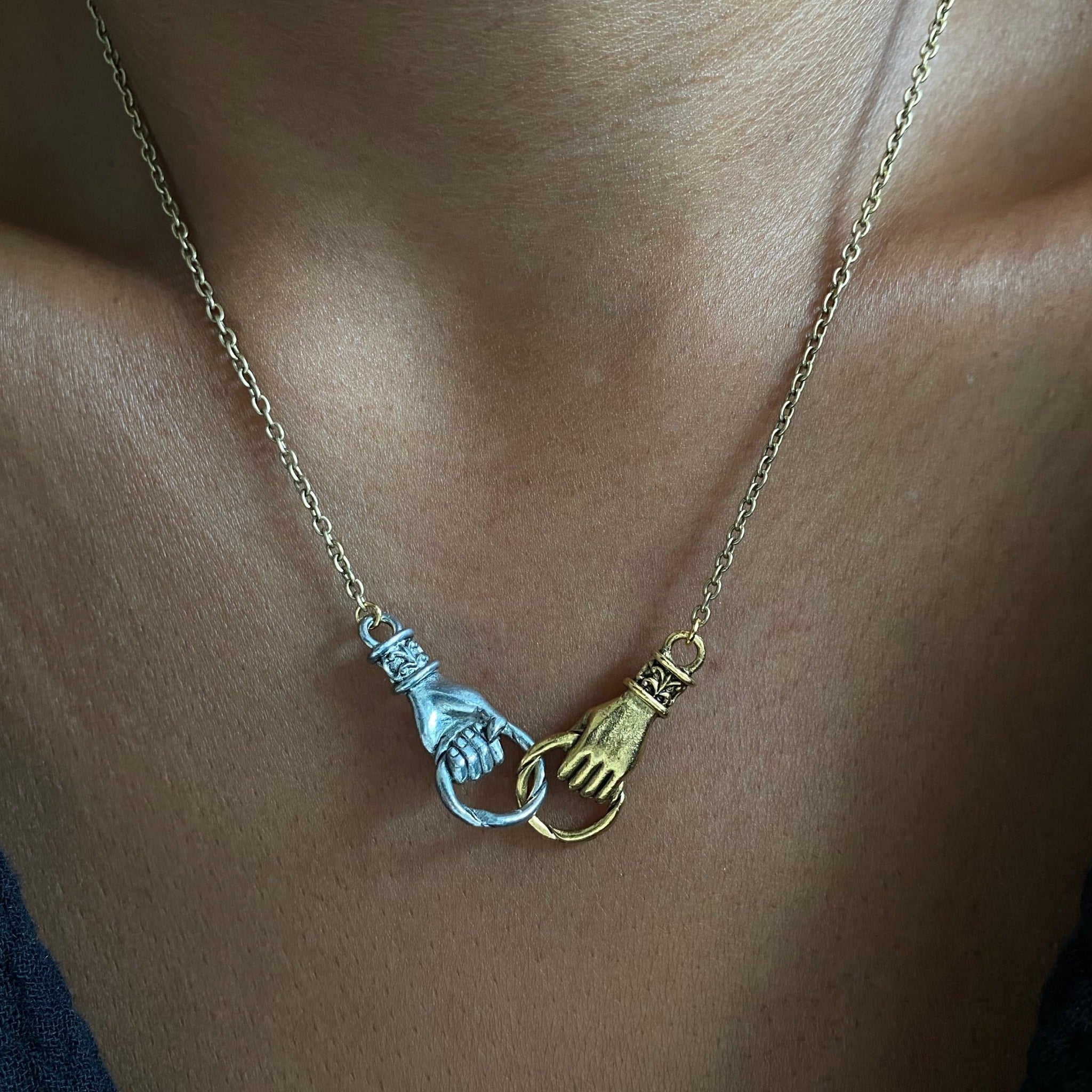 mixed metal hands necklace