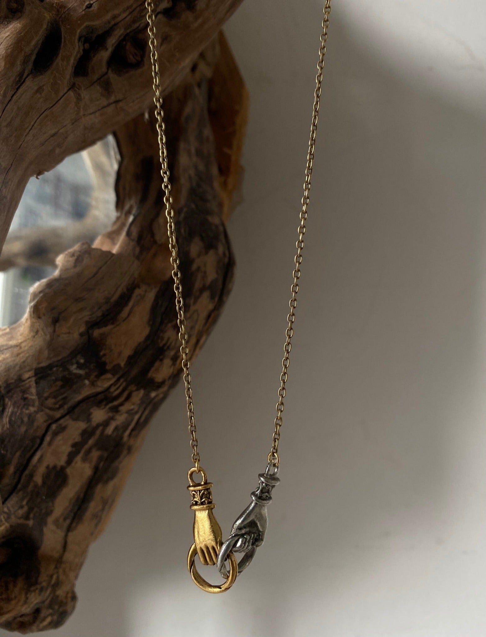 mixed metal hands connection necklace