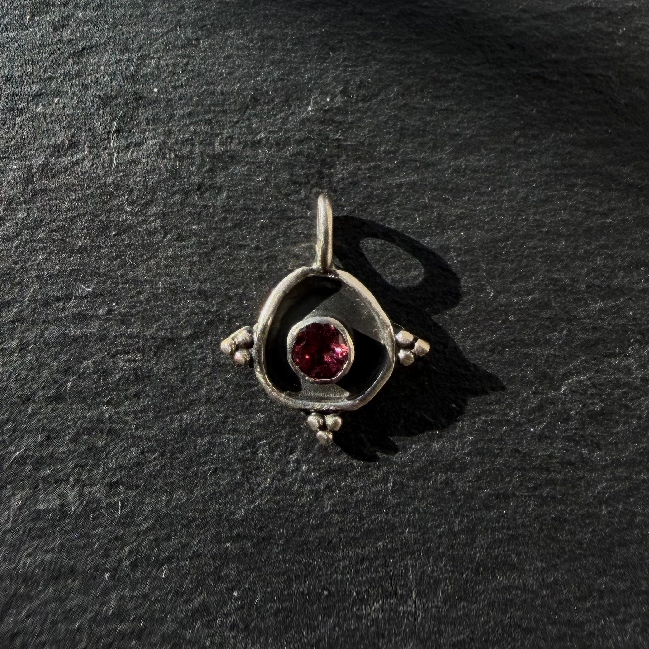 sterling silver evil eye pendant with pink tourmaline gemstone