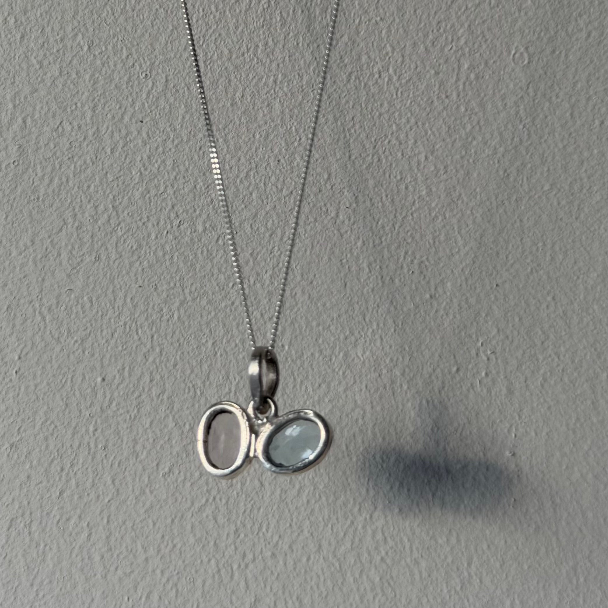 open design of rose quartz and blue topaz toi et moi pendant