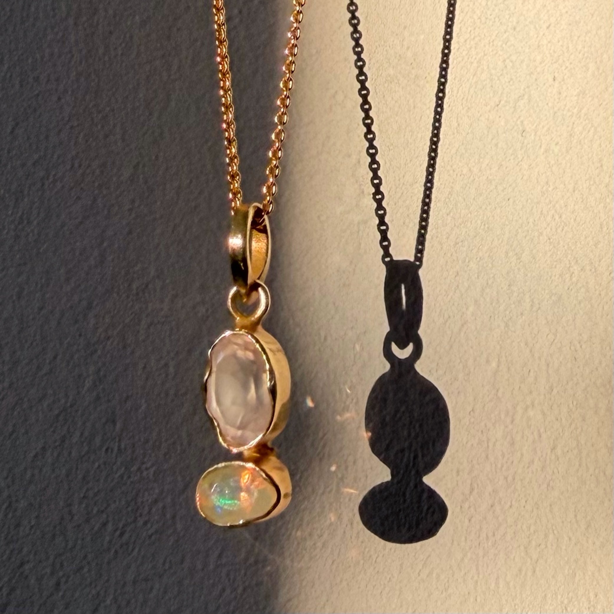 rose quartz and opal gold pendant close up