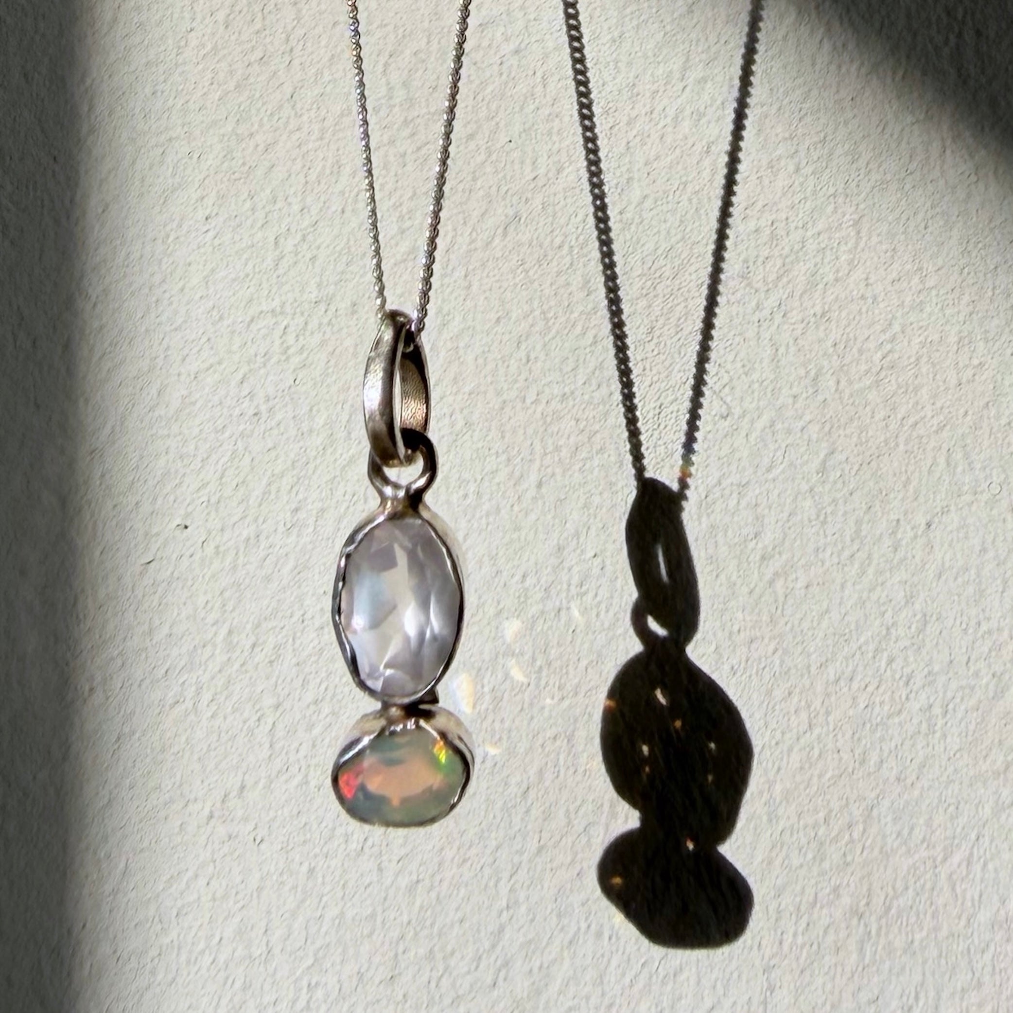 rose quartz and opal silver pendant up close