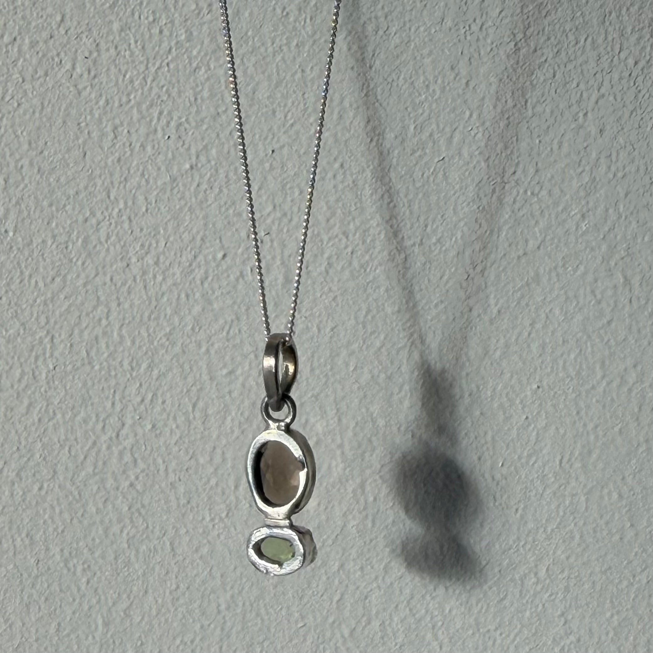 open back design of smoky quartz and peridot silver pendant