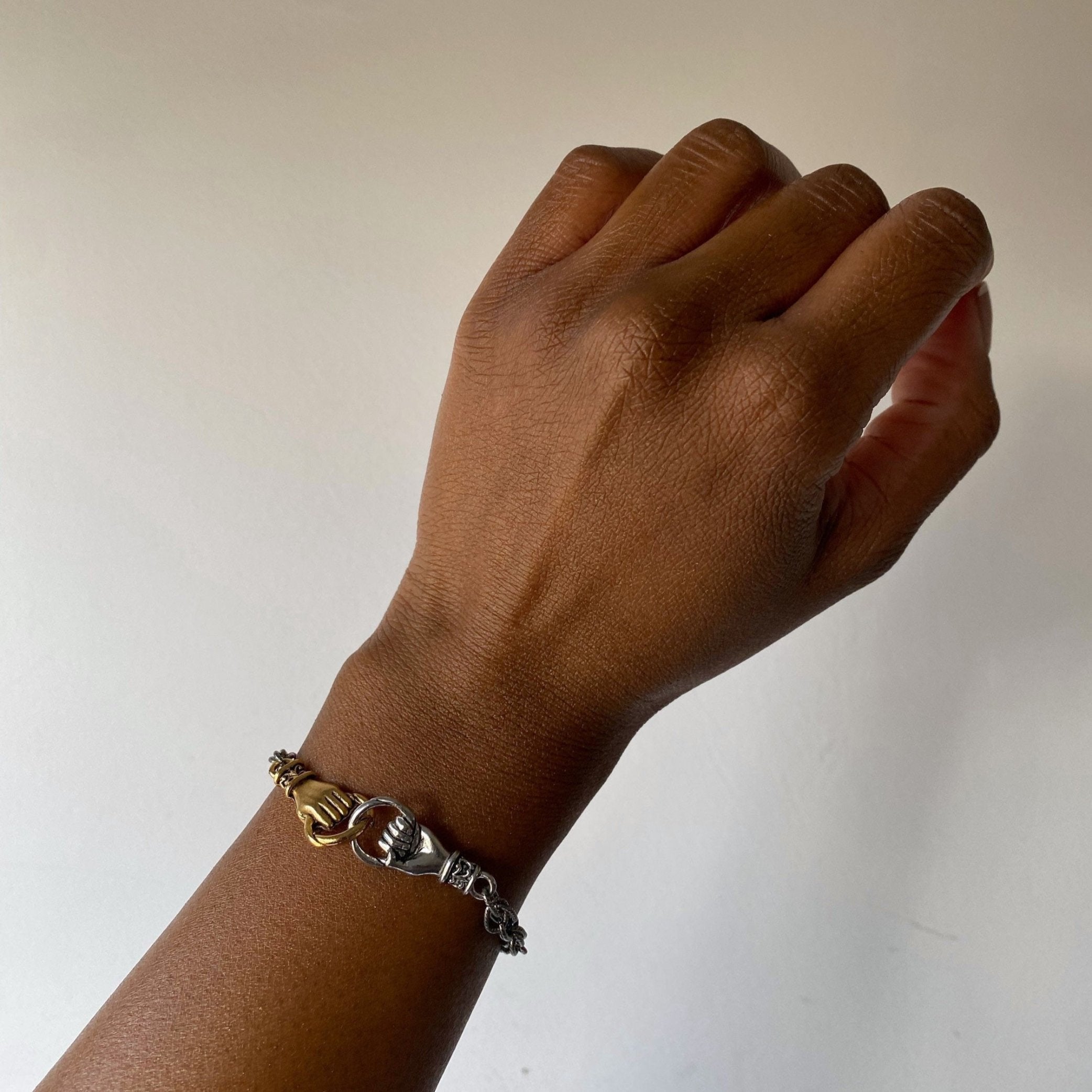 interlocking hands bracelet