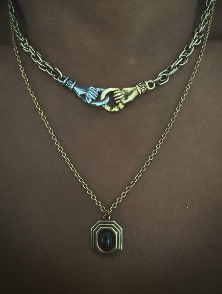 athena and hands necklaces