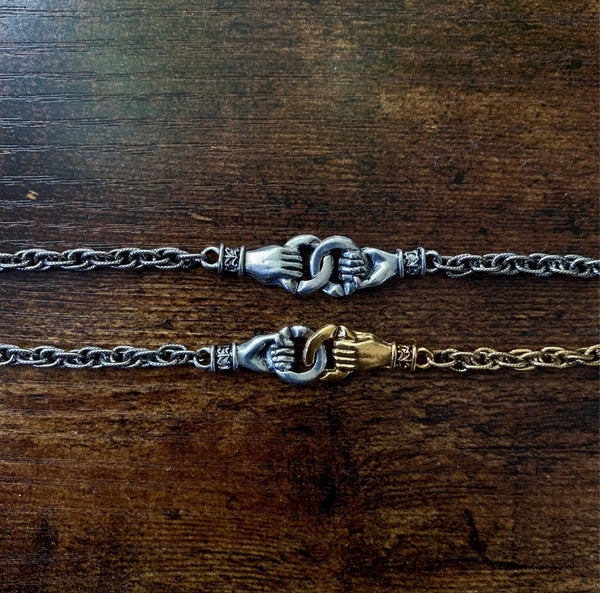 Mixed Metal Interlocking Hands Bracelet