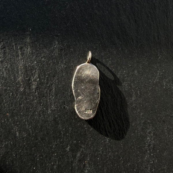 Back of handcrafted sterling silver yin yang pendant with amethyst and peridot