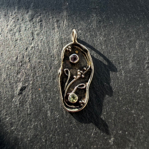 Handcrafted sterling silver yin yang pendant with amethyst and peridot gemstones