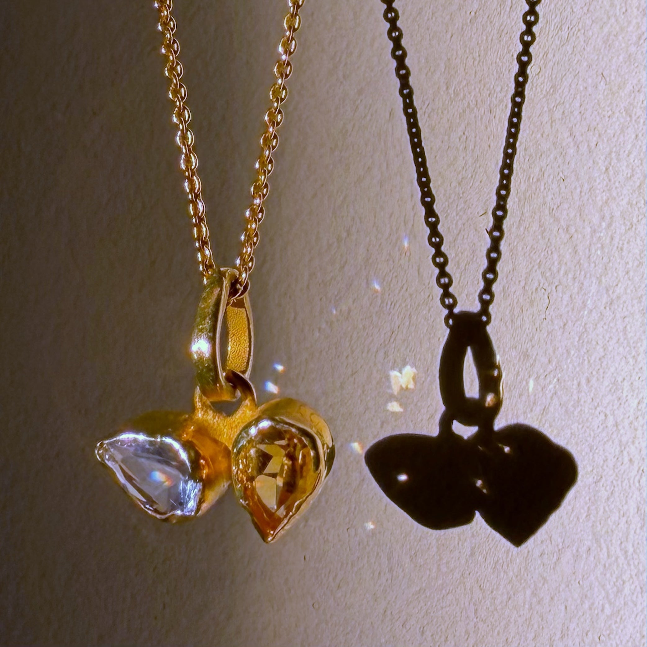 blue topaz and citrine gold pendant close up