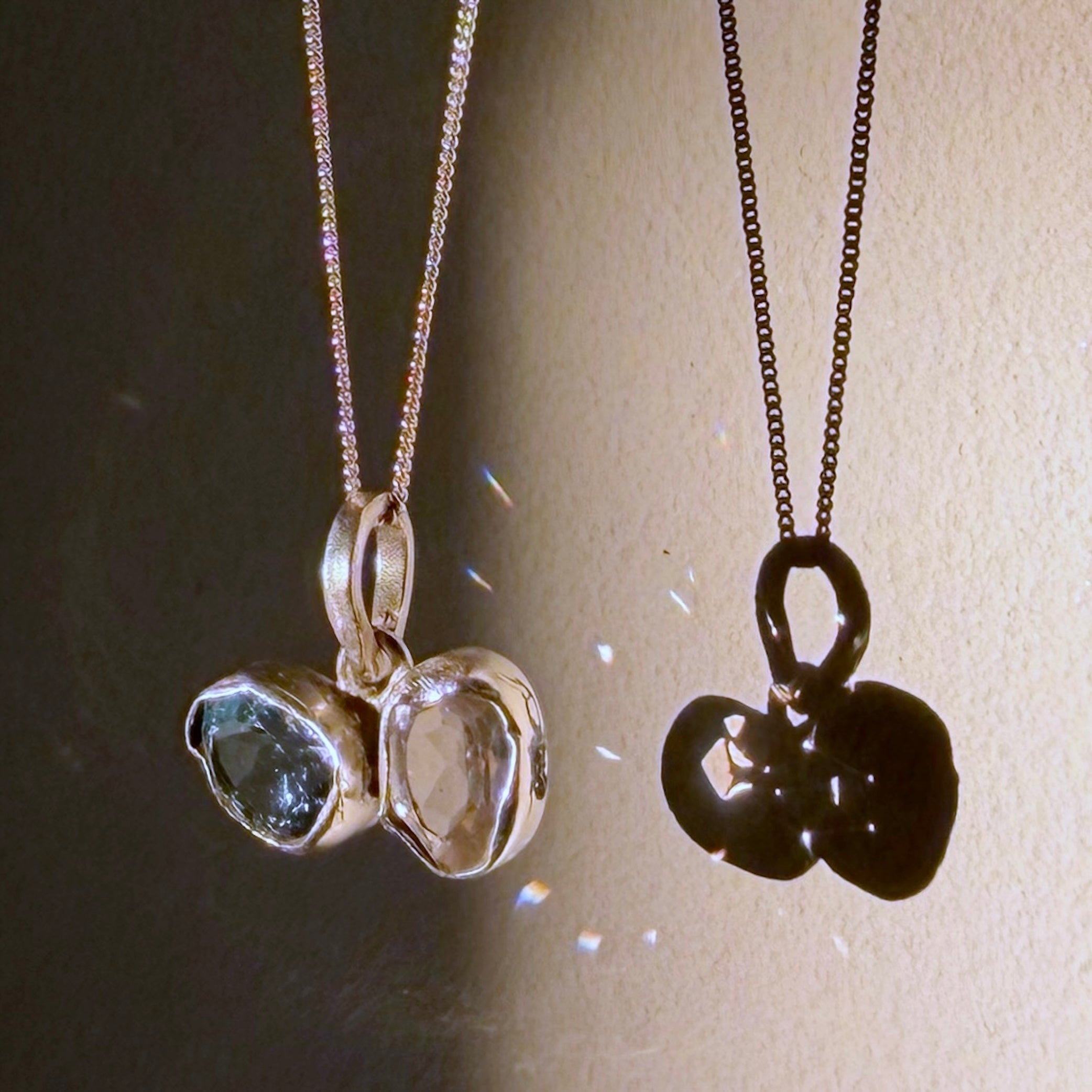 blue topaz and rose quartz silver pendant up close
