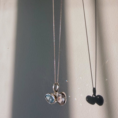 Blue topaz and rose quartz toi et moi pendant in sterling silver