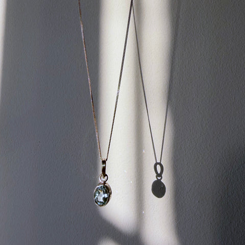 blue topaz sterling silver pendant in daylight