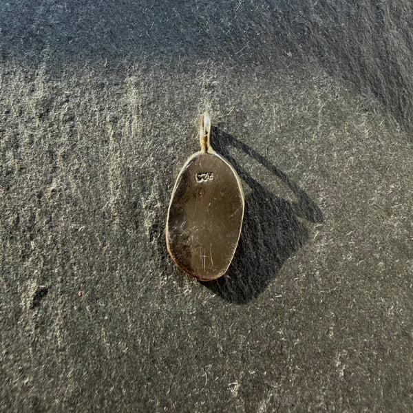 Back of handcrafted sterling silver Yin Yang talisman pendant with maker’s mark