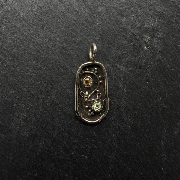 Handcrafted sterling silver Yin Yang talisman pendant with citrine and peridot gemstones