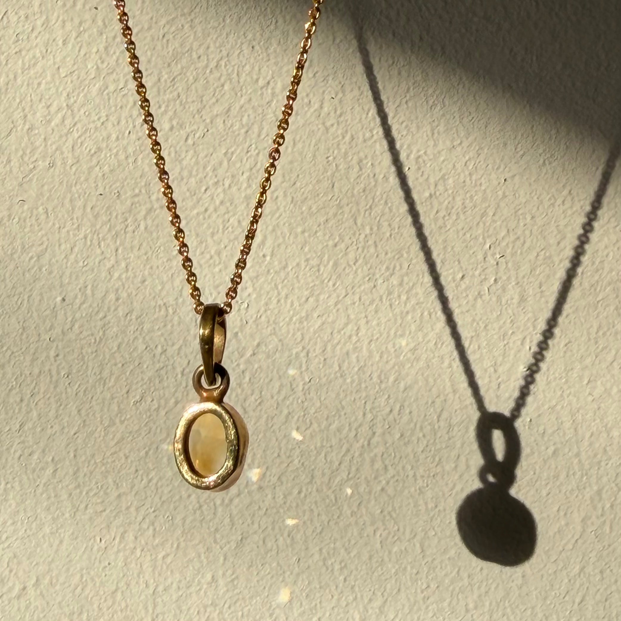 open back design of citrine gold pendant