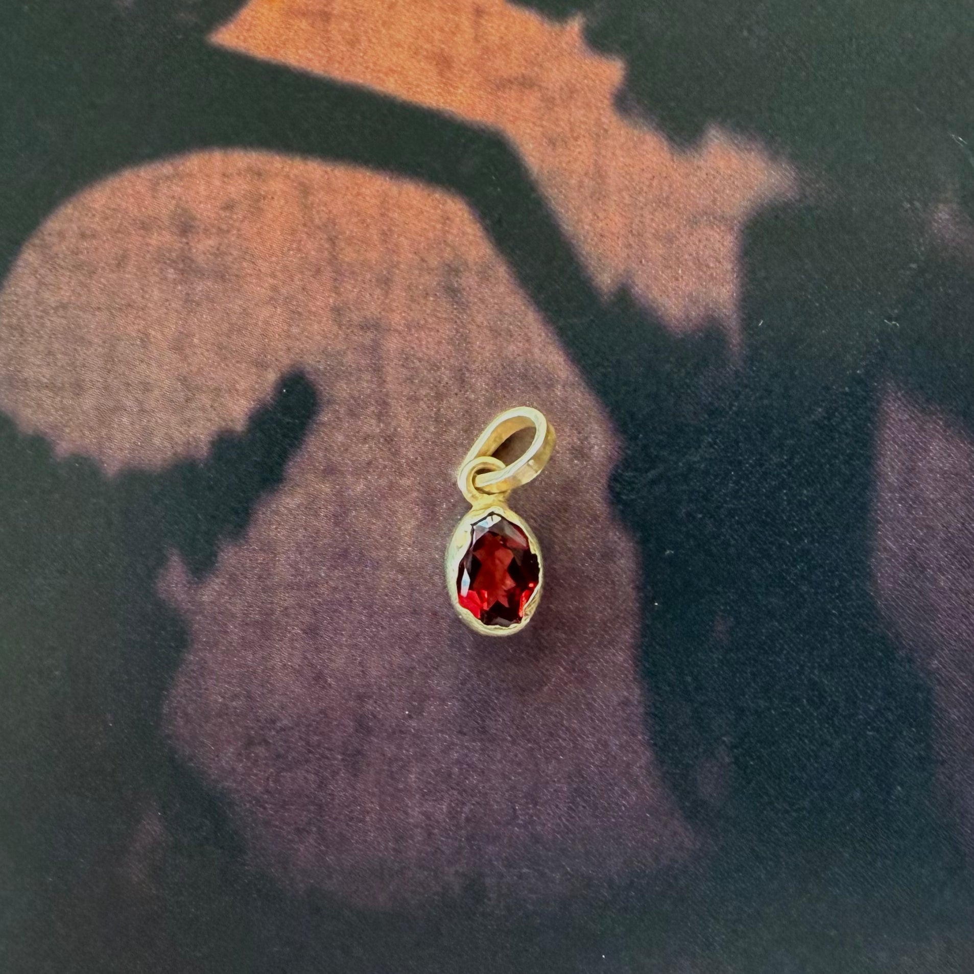 gold dipped garnet pendant handcrafted in bali