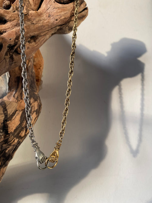 mixed metal united hands necklace