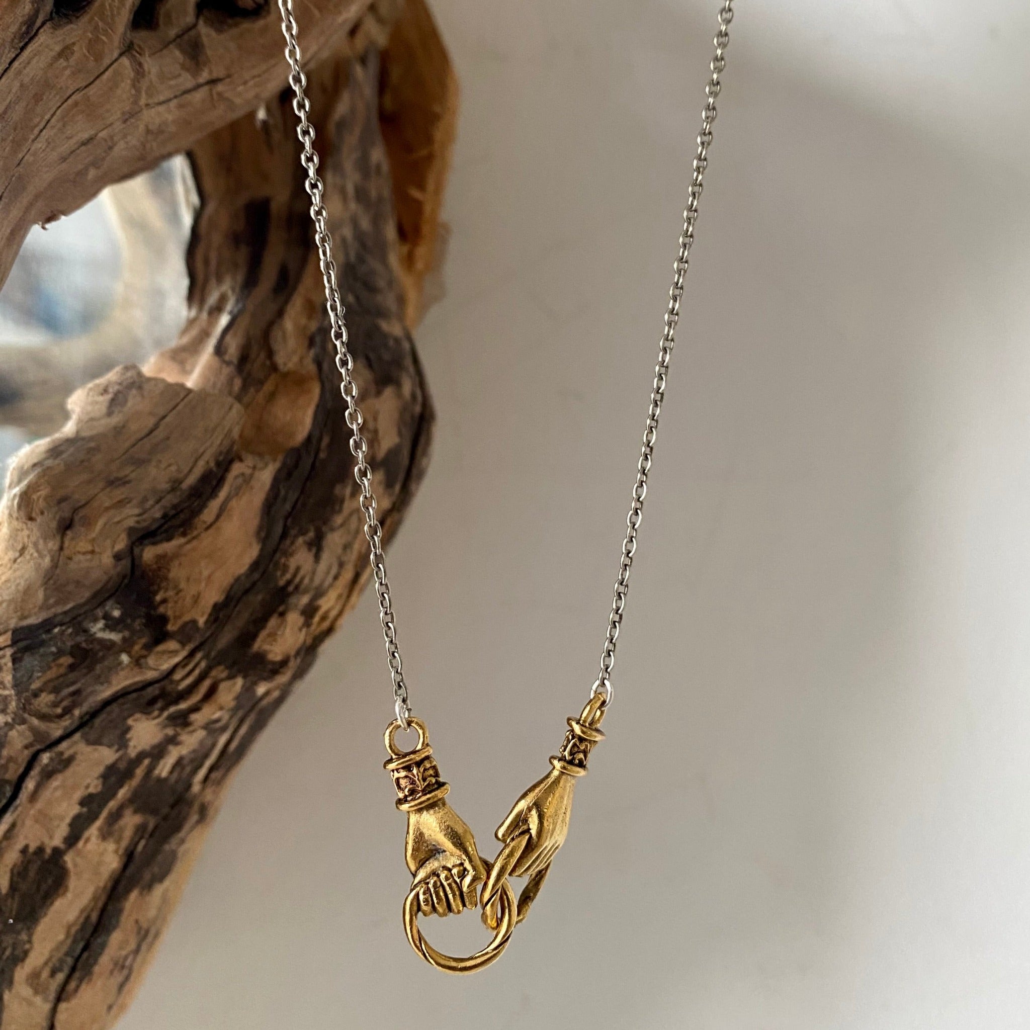 mixed metal unity necklace