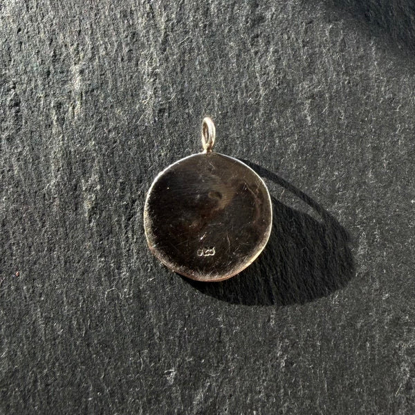 Back of handcrafted sterling silver Eye of Horus talisman pendant showing handmade texture