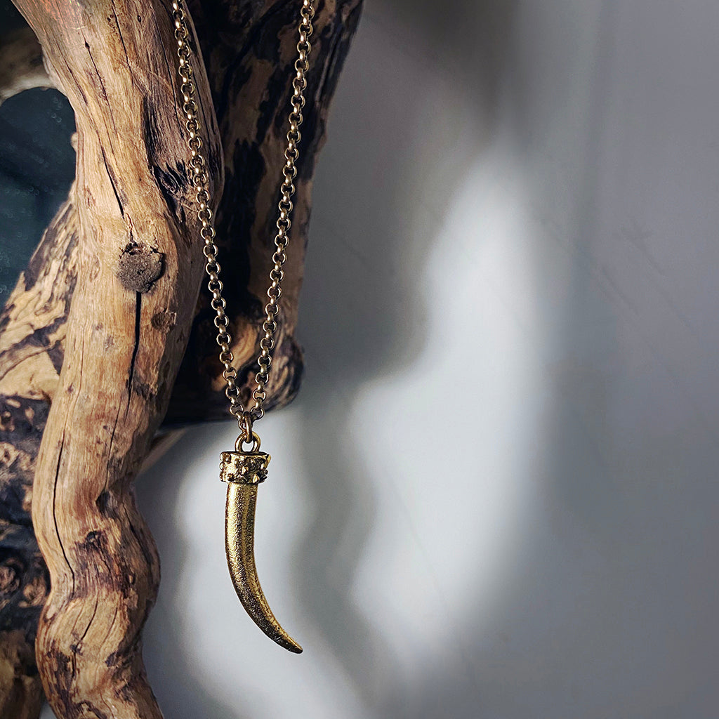 gold casted tusk pendant