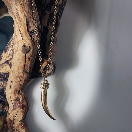 gold casted tusk pendant