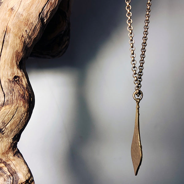 gold spear necklace with solid metal back, can be worn reversable